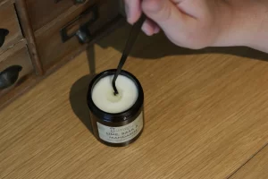 Picking out wick from pool of wax using Wick Dipper