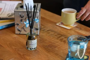 Wild Fig and Cassis Reed Diffuser on coffee table