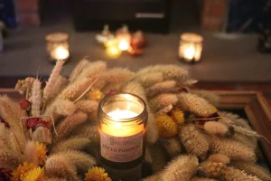 Spiced pumpkin candle in autumnal wreath